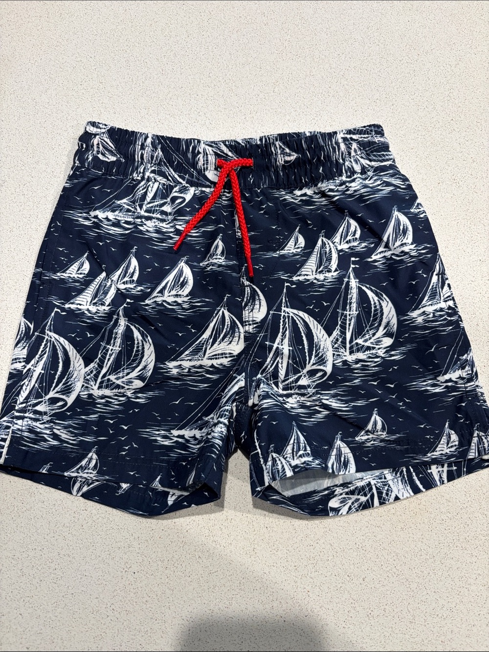 The Beaufort Bonnet Company Navy Sailboat Swim Trunks w/ Red Drawstring Size 2T